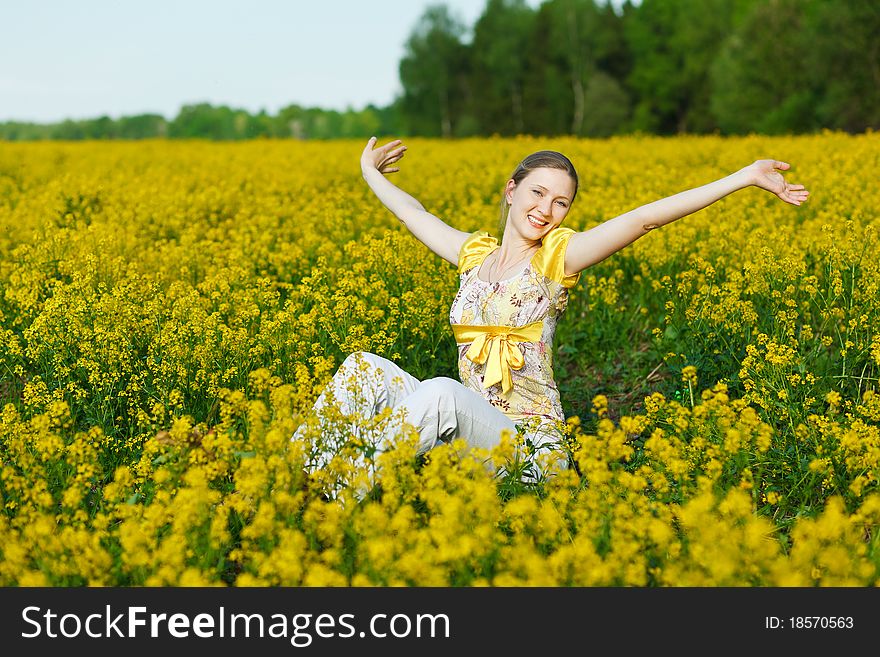 Happy woman on yellow field