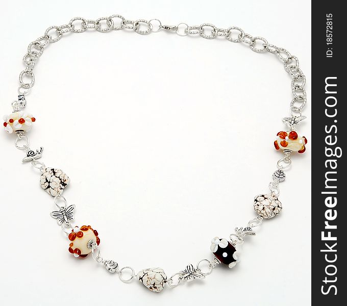 Necklace handmade from Murano glass on a white background