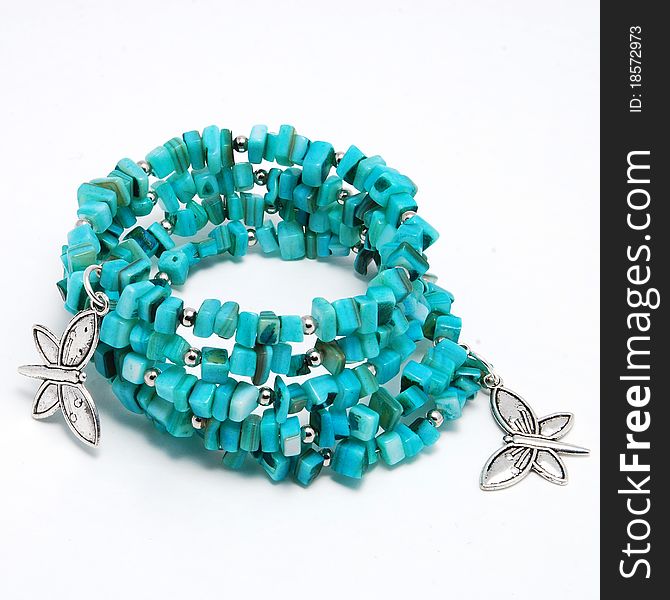 Blue bracelet with turquoise on white background