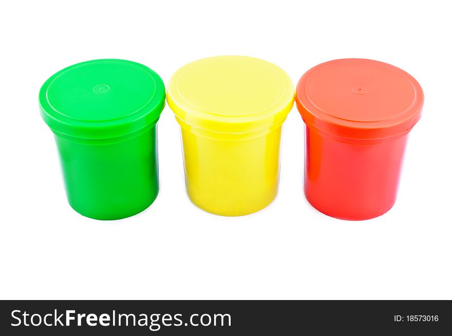 Three colored cans isolated on white background