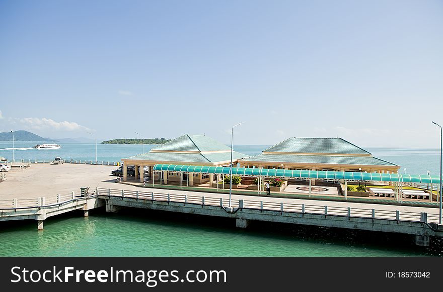 Pier against the backdrop of the turquoise sea. Pier against the backdrop of the turquoise sea