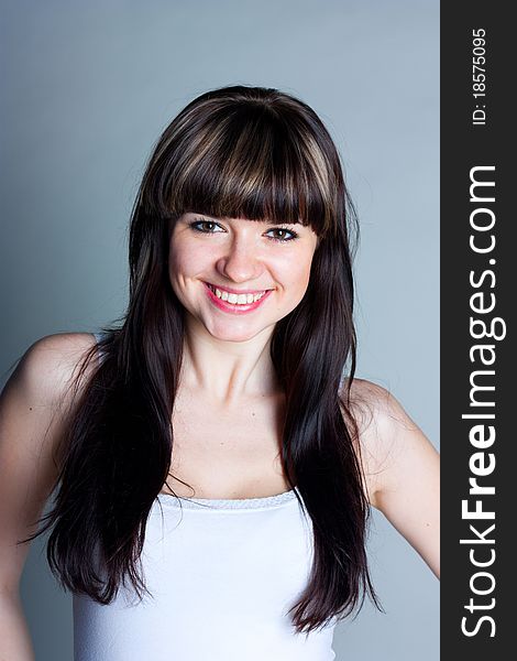 Beautiful girl on a gray background