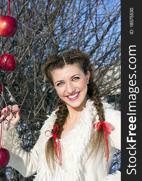 Smiling young woman with red apple. Smiling young woman with red apple