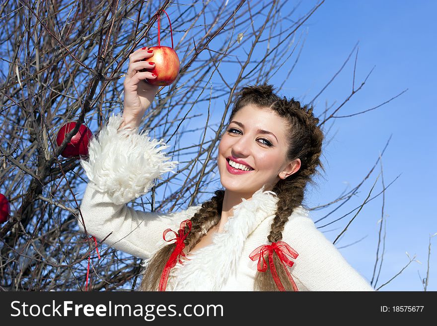 Smiling young woman with red apple. Smiling young woman with red apple