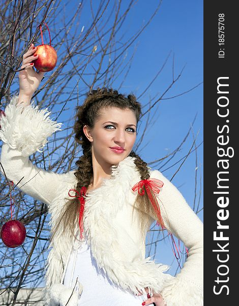 Smiling Young Woman With Red Apple