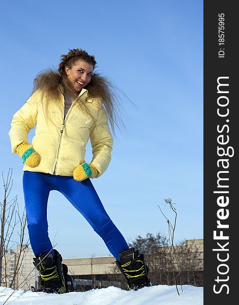 Portrait of a young beautiful woman on the snowboard. Portrait of a young beautiful woman on the snowboard