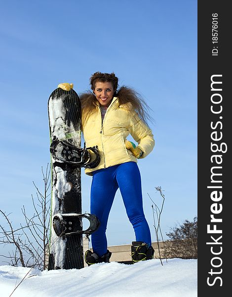 Portrait of a young beautiful woman on the snowboard. Portrait of a young beautiful woman on the snowboard