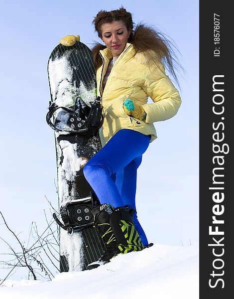 Young Joyful Snowboarder Woman At Mountains