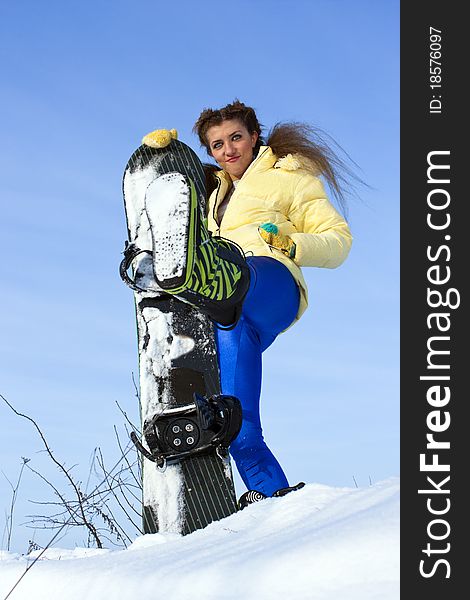 Young joyful snowboarder woman at mountains. Young joyful snowboarder woman at mountains