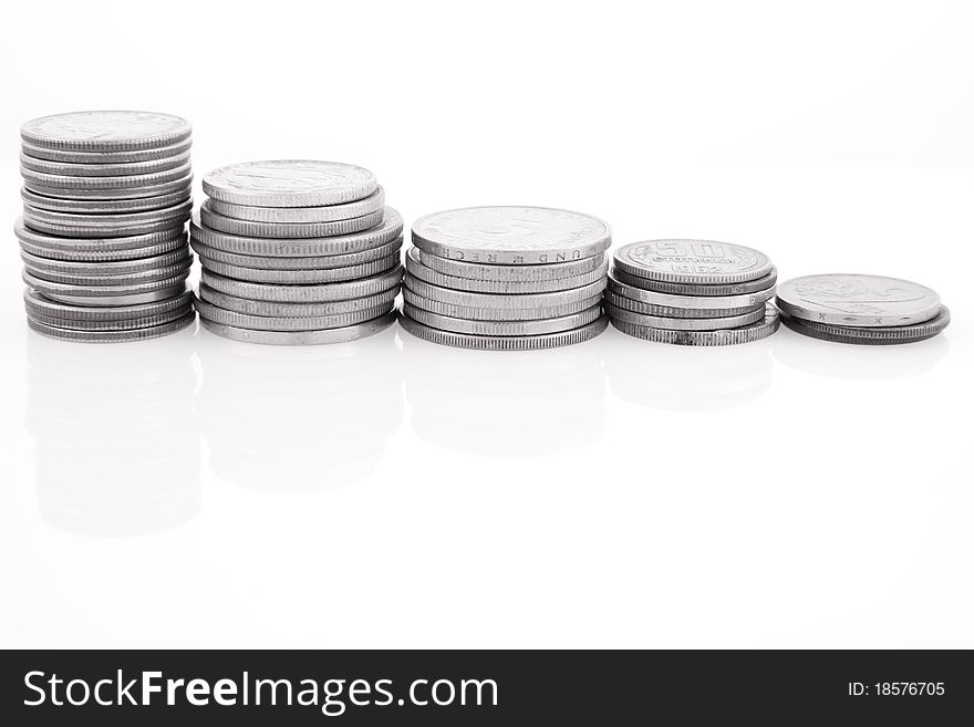 Columns of coins on white background in black and white. Columns of coins on white background in black and white