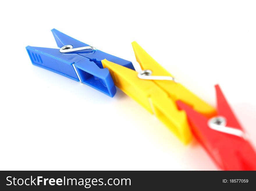 Colored clothespins isolated on white background