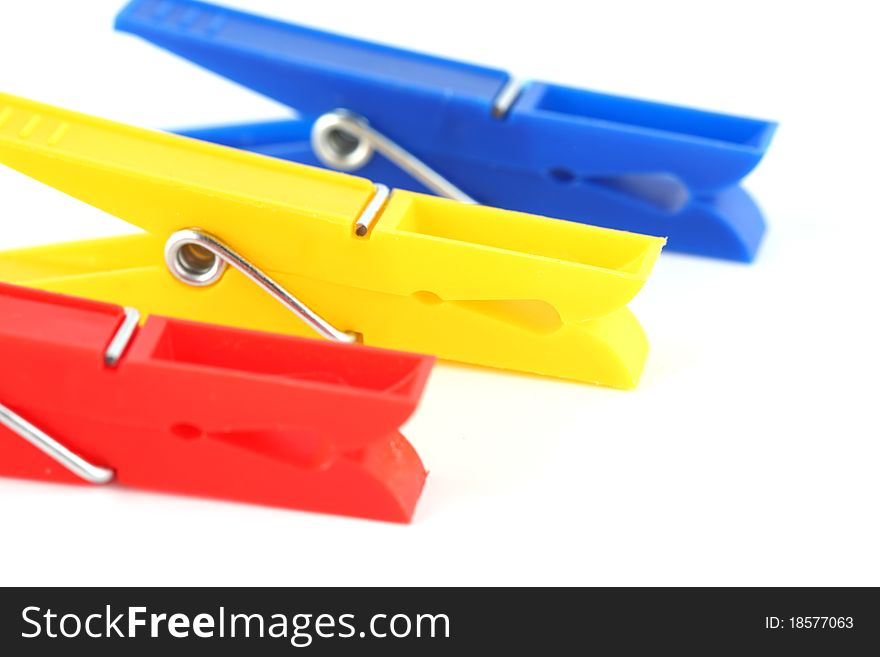Colored clothespins isolated on white background