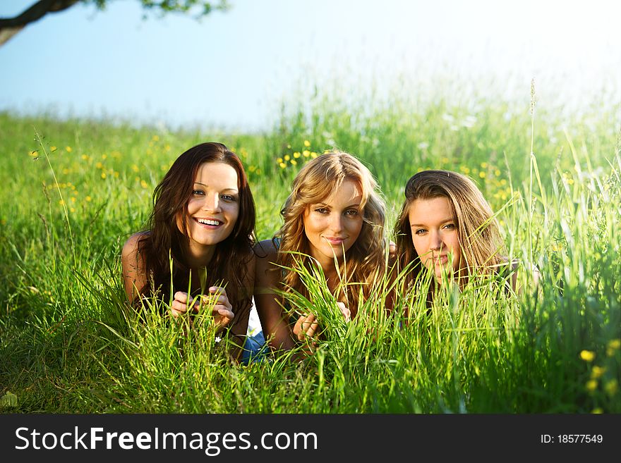 Girlfriends under tree