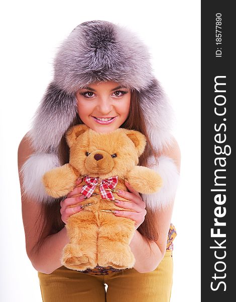 Beautiful longhair girl is holding the teddy bear. Beautiful longhair girl is holding the teddy bear