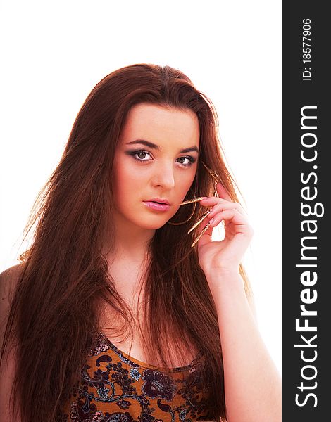 Beautiful young longhair brunette in a romantic pose. Beautiful young longhair brunette in a romantic pose