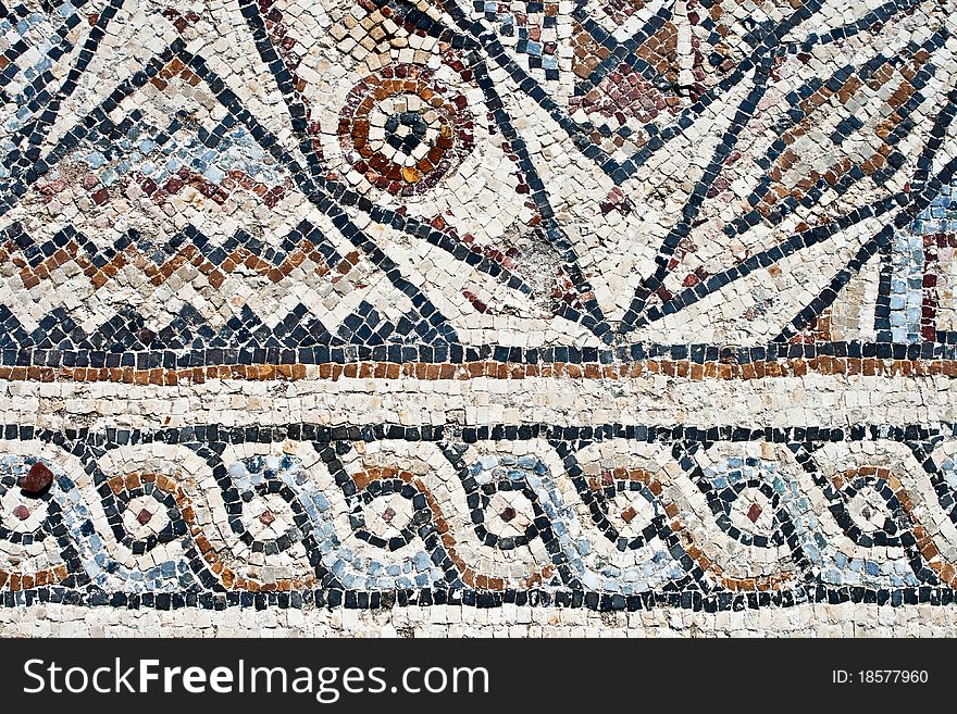 Fragment of an ancient geometrical colorful floor mosaic in Herod`s Palace. Caesarea, Israel. Fragment of an ancient geometrical colorful floor mosaic in Herod`s Palace. Caesarea, Israel