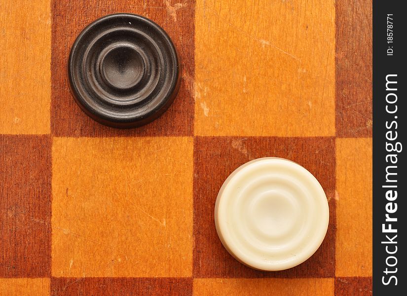 Checkers on old wood board. Checkers on old wood board