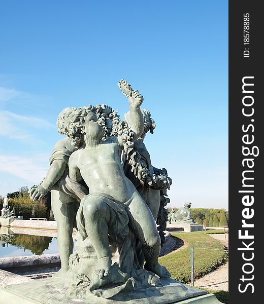 Boy and Pigeon Statue at Versailles castle in France . Boy and Pigeon Statue at Versailles castle in France .