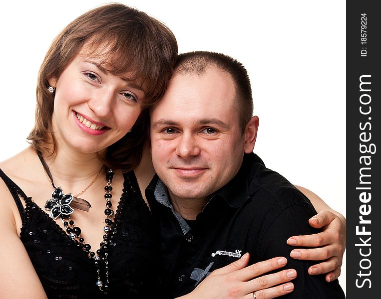 Portrait of a beautiful young happy smiling couple isolated on white