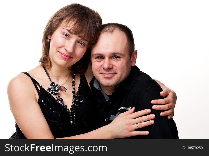 Portrait of a beautiful young happy smiling couple isolated on white