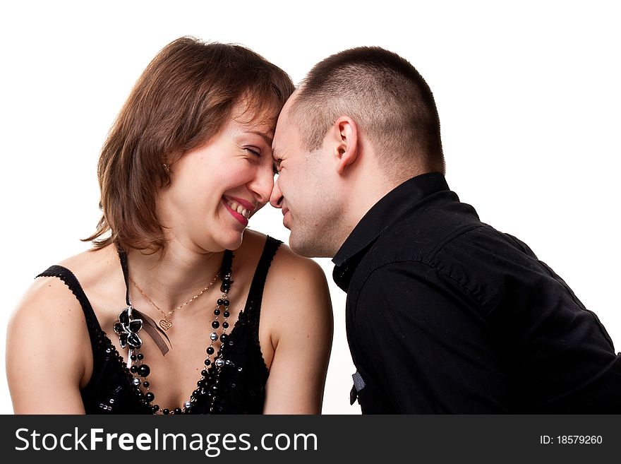 Portrait of a beautiful young happy smiling couple isolated on white