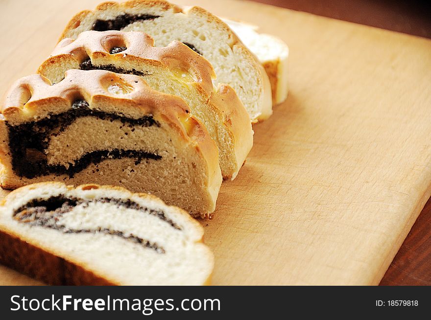 Fresh baked bread roll with poppy seeds