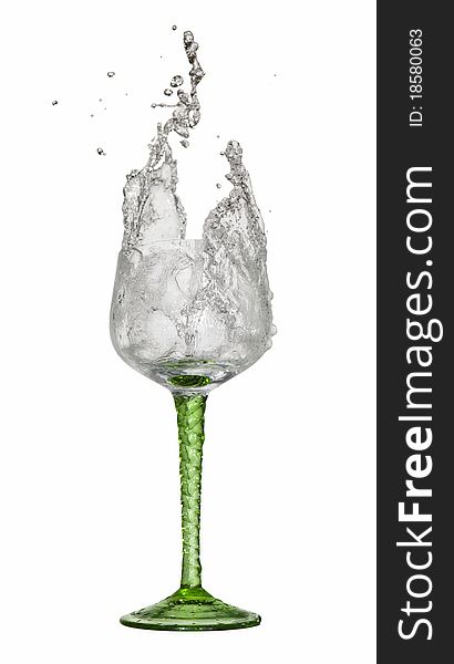 Water splashing out of a glass on white background