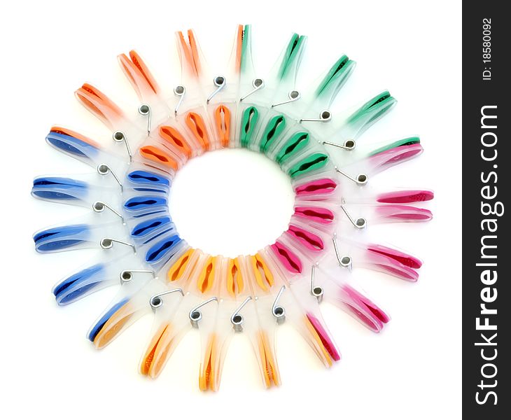 Colorful clothes-pegs on a white background. Colorful clothes-pegs on a white background