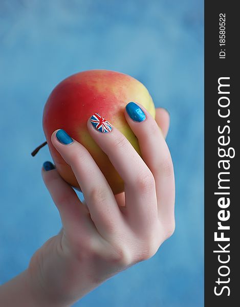 Hand with manicure in British Flag stile. Hand with manicure in British Flag stile
