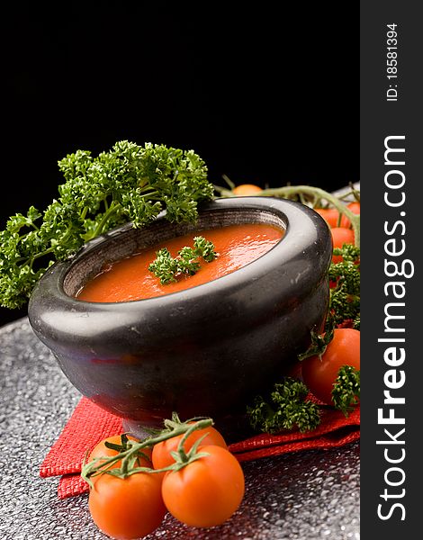 Photo of delicious tomatoe sauce with parsley on red cloth