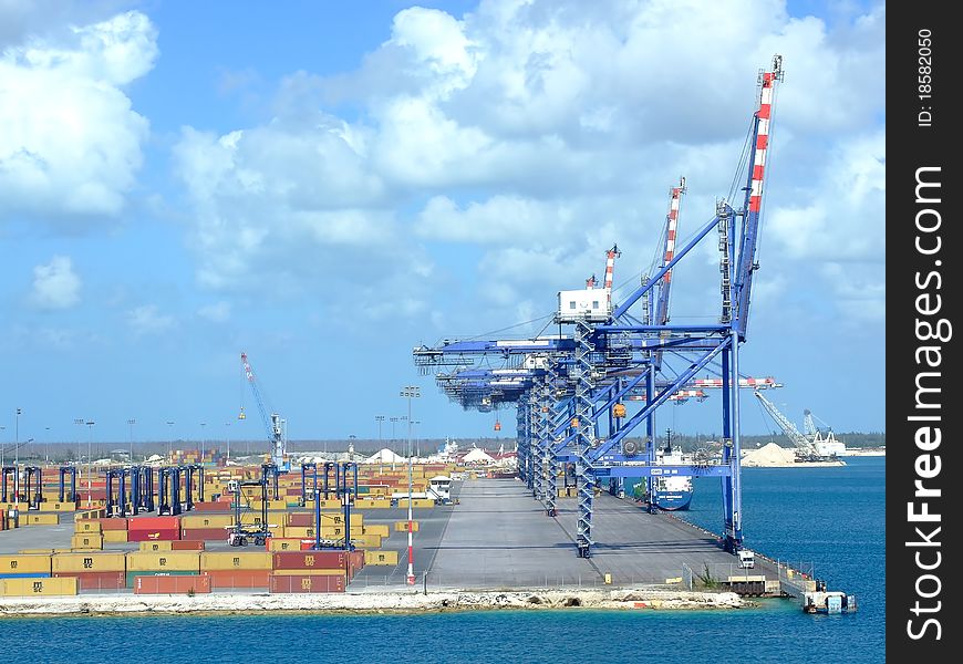 A tropical artificial island used as a loading/unloading transfer station for various cargo closer view. A tropical artificial island used as a loading/unloading transfer station for various cargo closer view