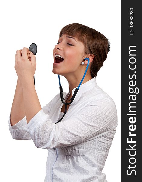 Beautiful young woman doctor with a stethoscope sings on a white background