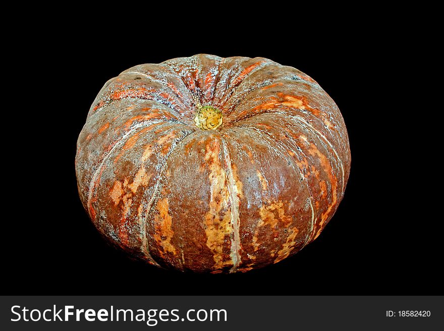 Ripe fresh raw pumpkin isolated on black background