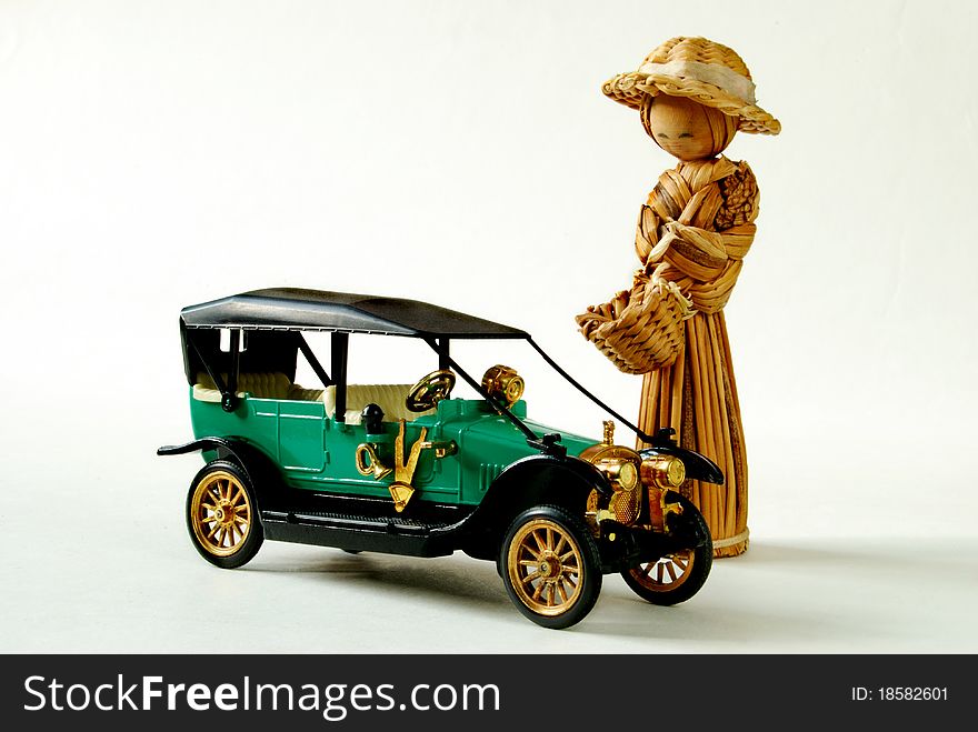 Straw girl with wicker basket with vintage cars. Straw girl with wicker basket with vintage cars