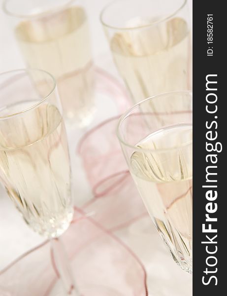Close up of filled champagne glasses