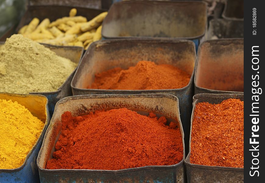Colorful powdered indian spices at the marked. Colorful powdered indian spices at the marked