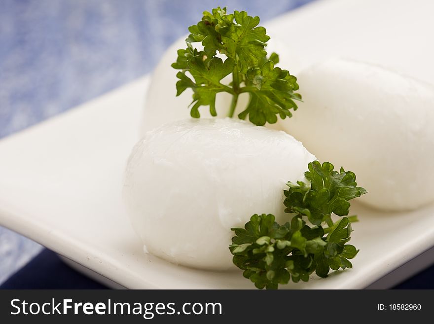 Photo of delicious mozzarella cheese with parsley