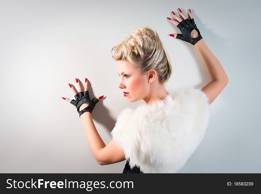 Seek woman wearing black gloves on studio neutral background