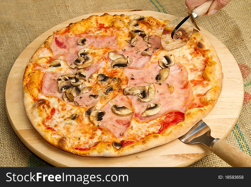 Italian pizza with ham and mushroom