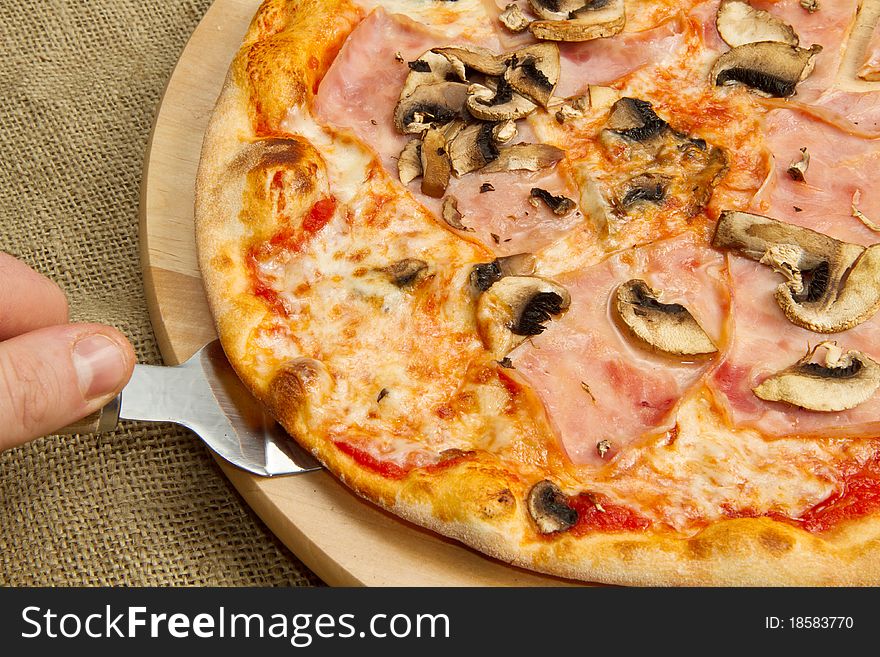 Italian pizza with ham and mushroom