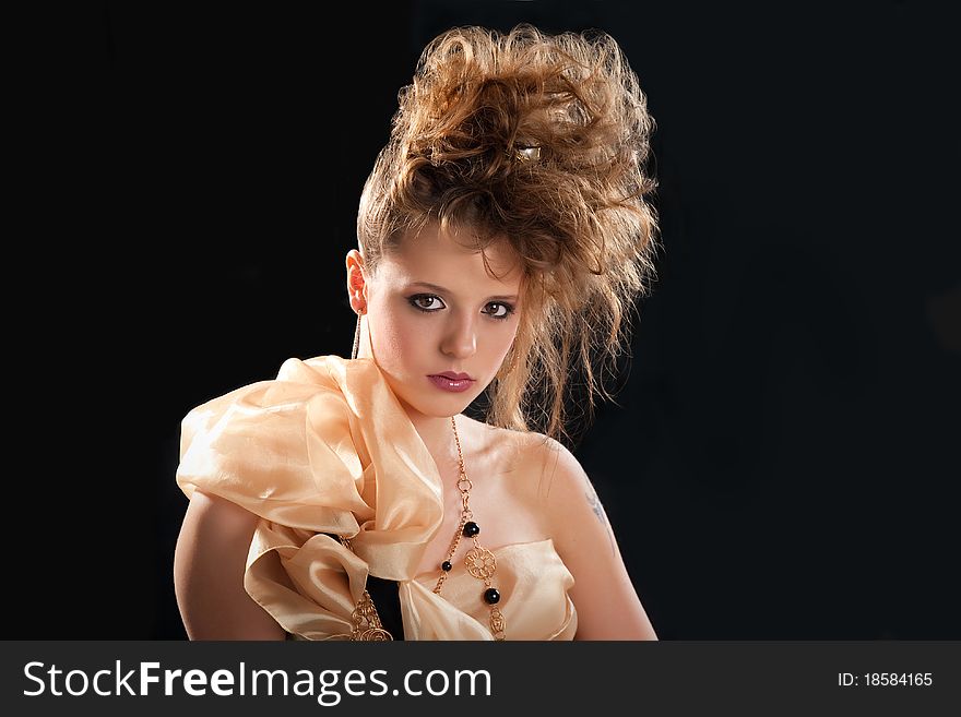 Young woman glamor portrait on black background