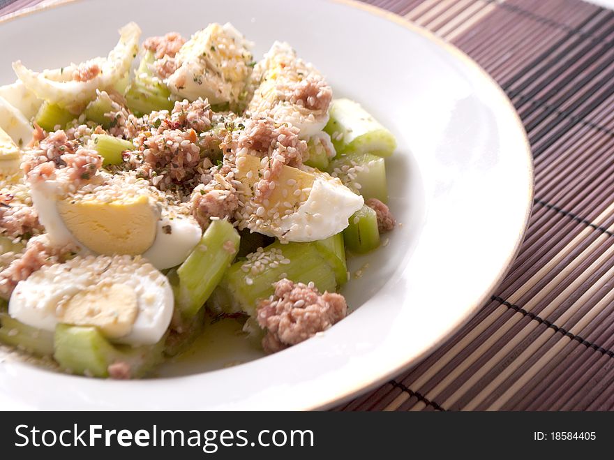 Plate with salmom salad with eggs and celery. Plate with salmom salad with eggs and celery