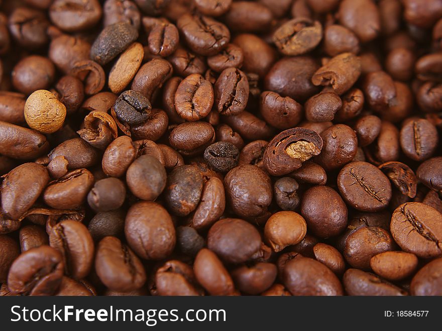 Brown coffee beans ready for grinding.
