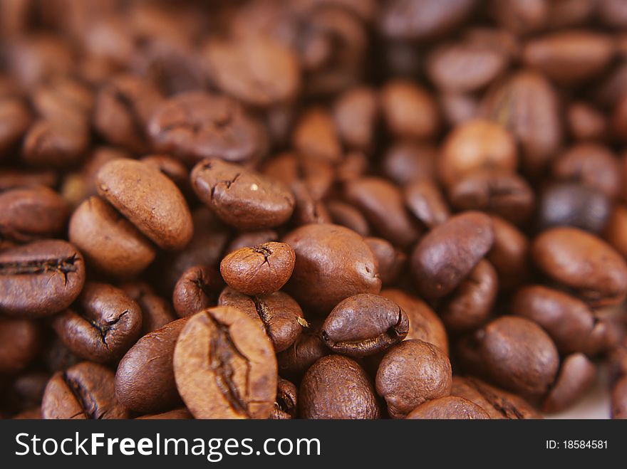 Brown coffee beans ready for grinding.