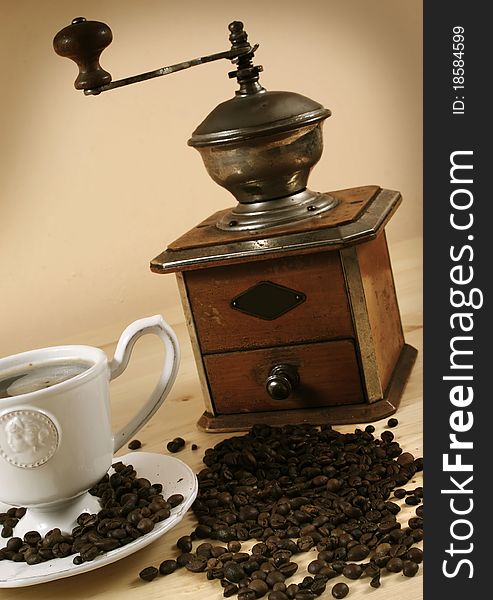 Black coffee and a coffee grinder. Black coffee and a coffee grinder.