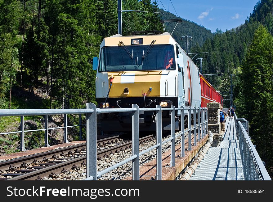 Swiss train on the bridge near Wiesen