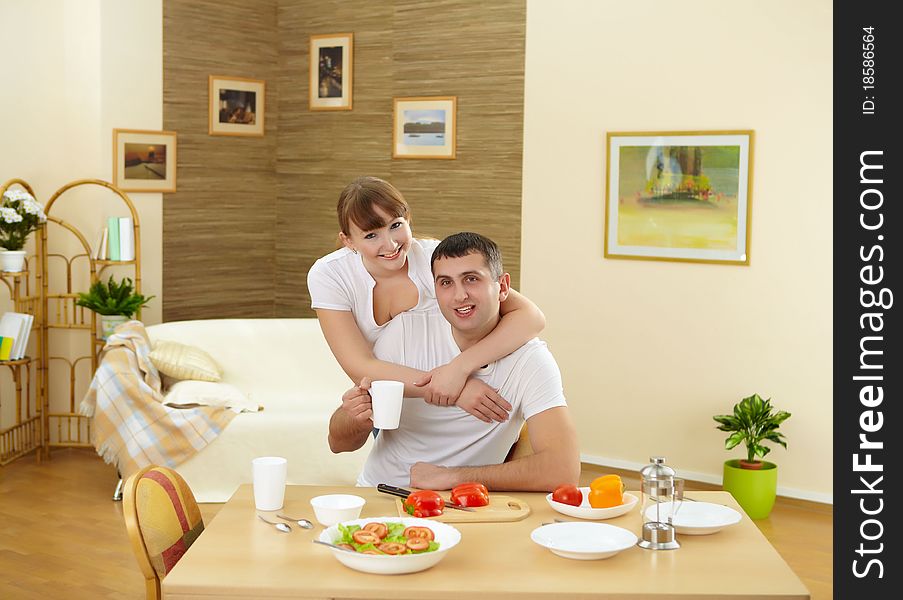 Young couple in love at home eating together and having fun. Young couple in love at home eating together and having fun