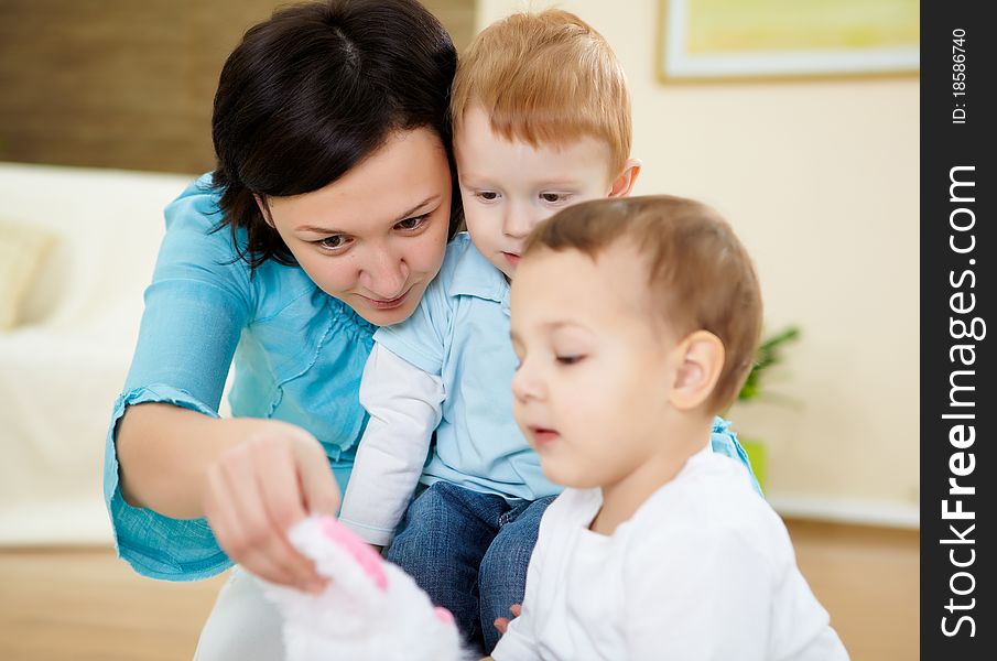 Mother And Son At Home On The Floor