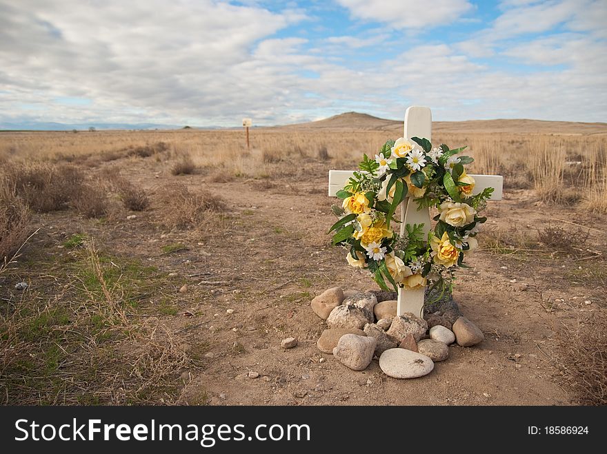 A flower filled roadside rememberance site.