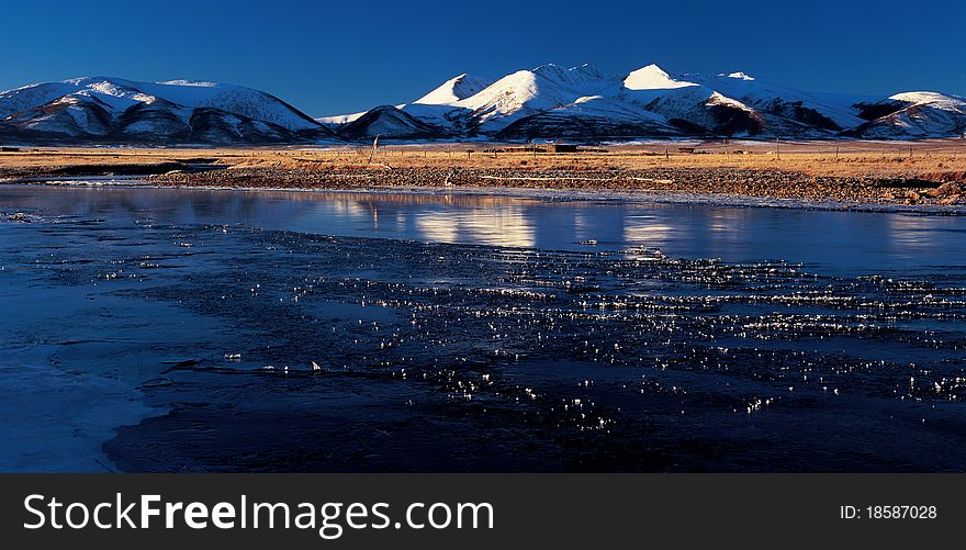Snow mount by the river,view in Tibet